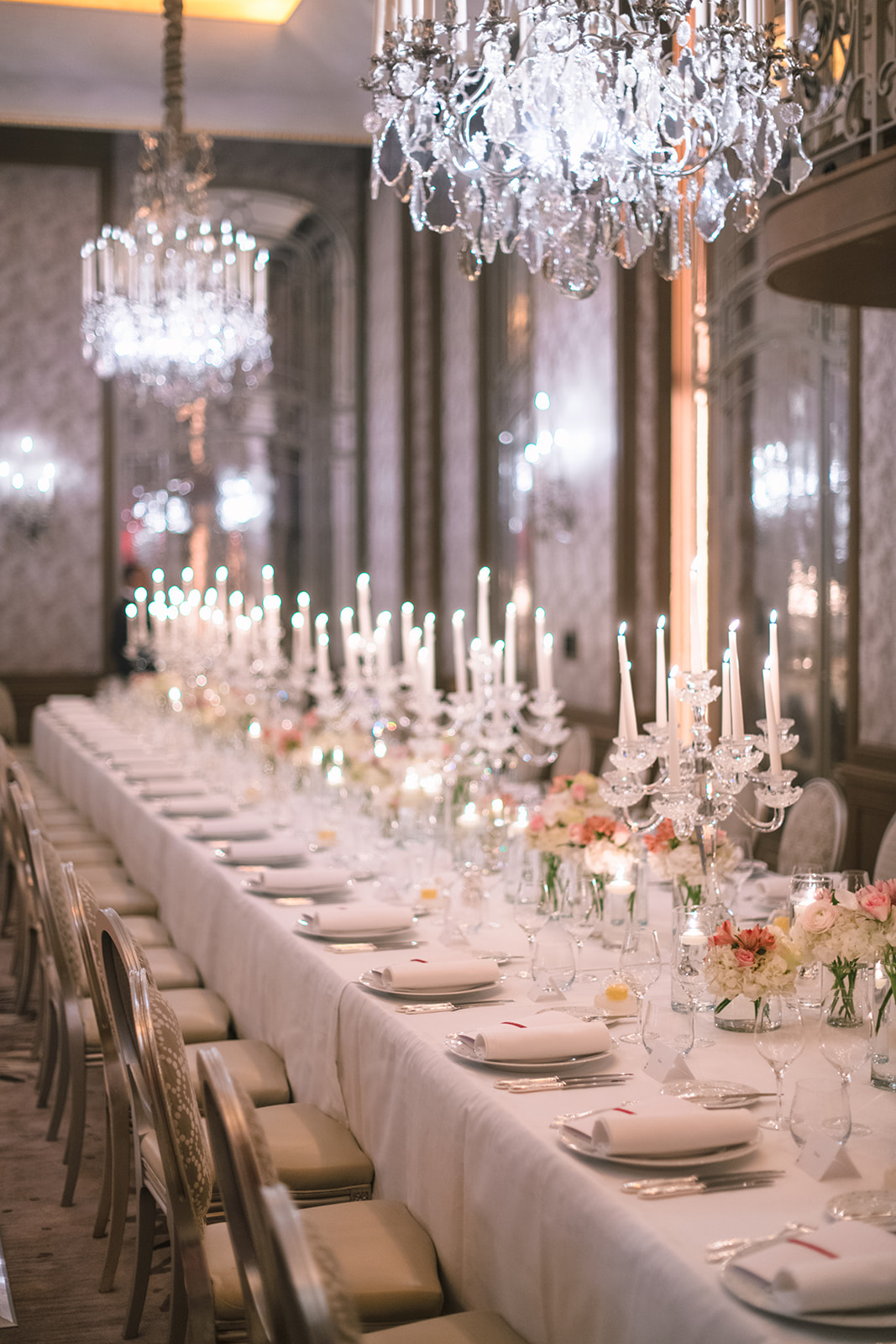 Long candlelit wedding reception table at Hôtel Plaza Athénée Paris